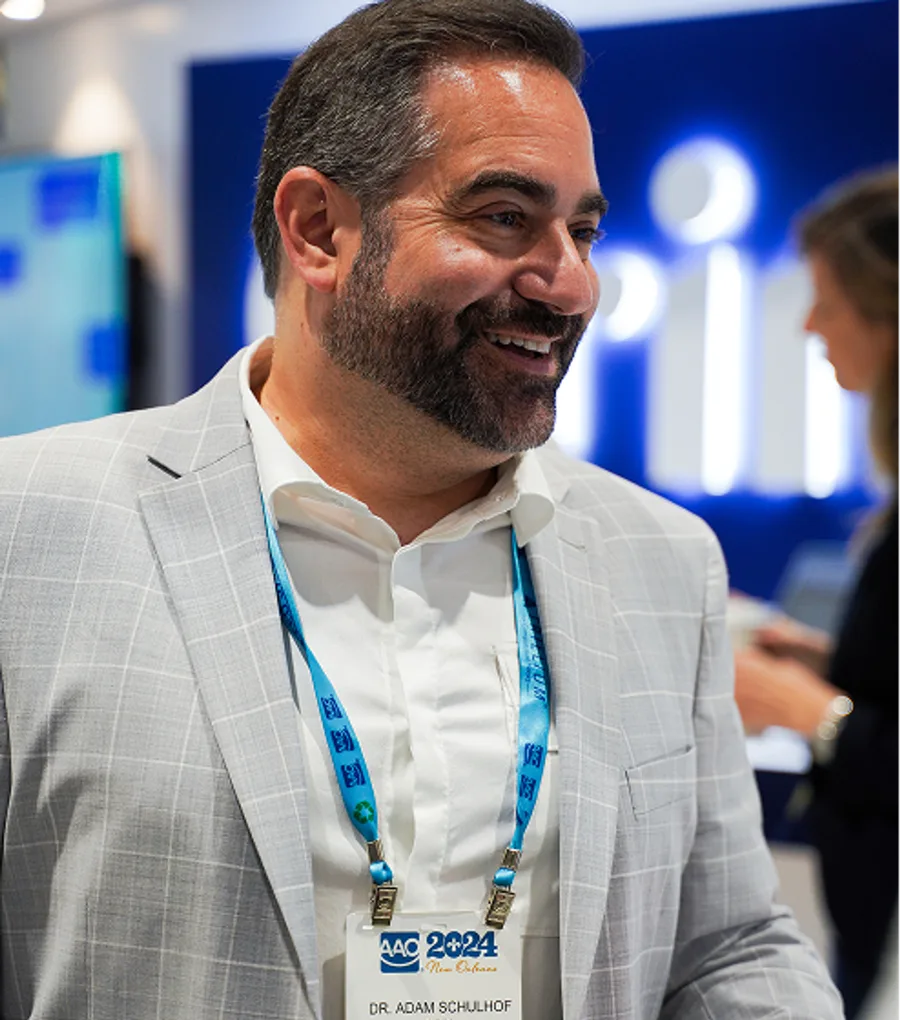 Dr. Adam Schulhof, Grin founder, at a Grin conference booth