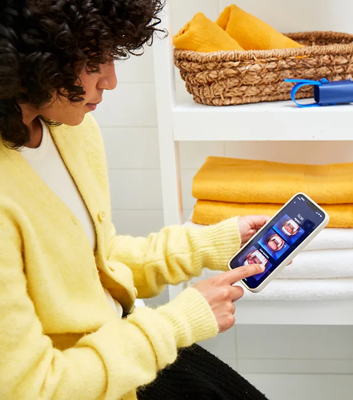 A patient opening the Grin App on their phone at home